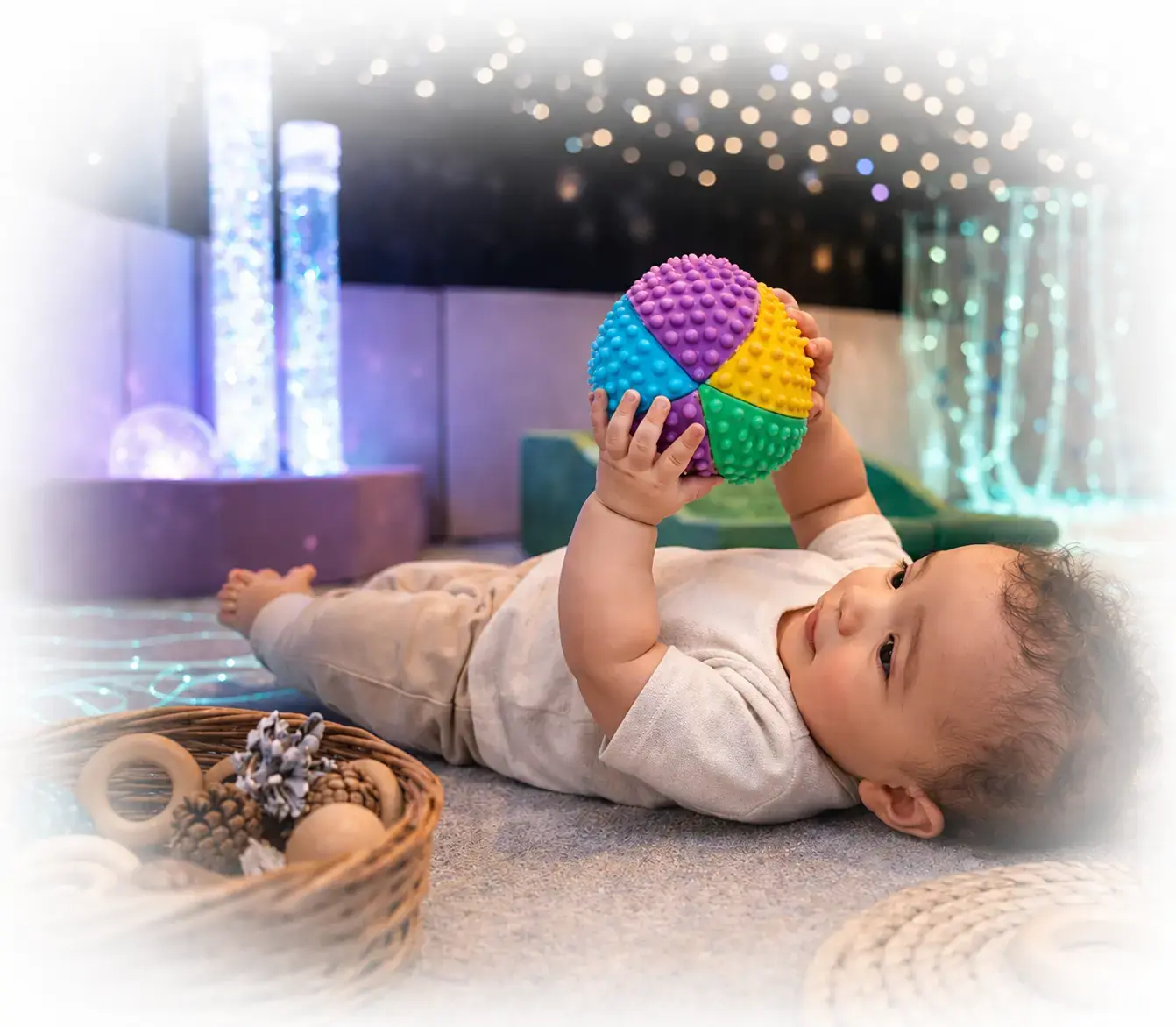 Illustrated toddler happily playing with alphabet blocks on the floor